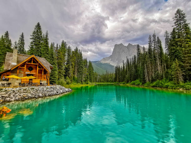 Emerald Lake is located in Yoho National Park, British Columbia, Canada, and it is the largest of 61 lakes and ponds located in this park. Mount Burgess looms over this lake. Stormy skies and rain make for a rather dramatic landscape.