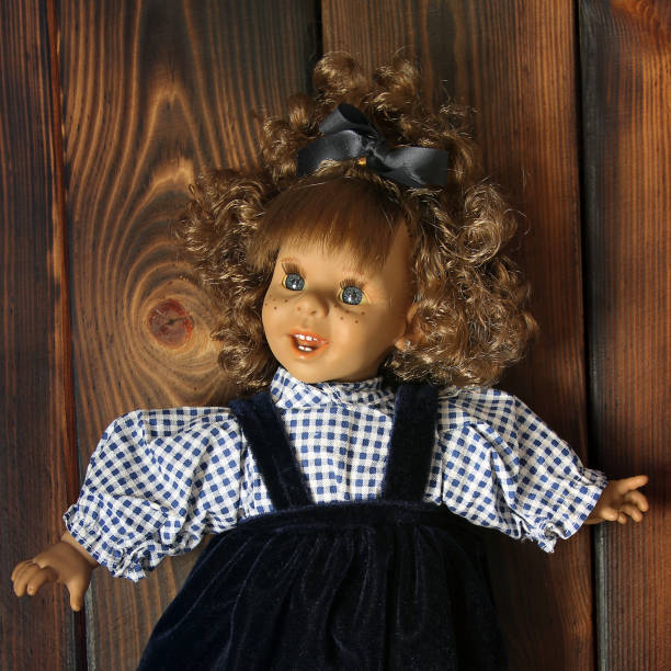 istock Baby doll on wooden background 1173618196