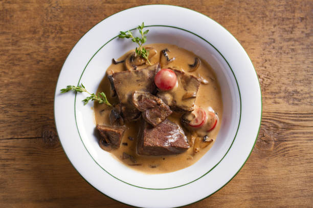 istock Braised veal cheeks in cream sauce with mushrooms 1173618340
