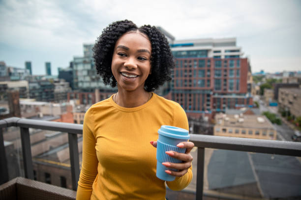 istock Woman Holding a Reusable Cup 1173618427