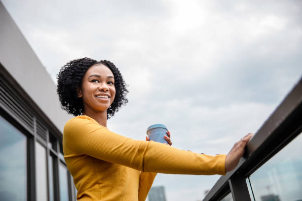 istock Woman Holding a Reusable Cup 1173618863