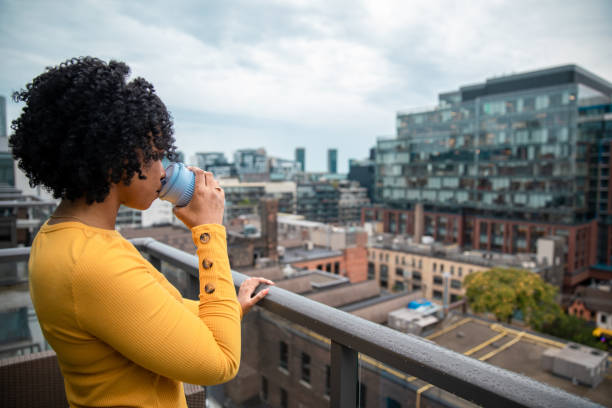 istock Woman Holding a Reusable Cup 1173618933