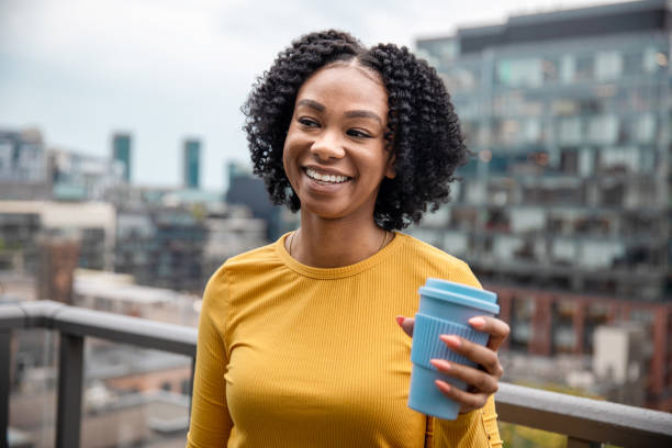 istock Woman Holding a Reusable Cup 1173618936