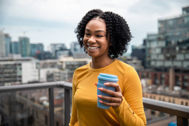 istock Woman Holding a Reusable Cup 1173618945