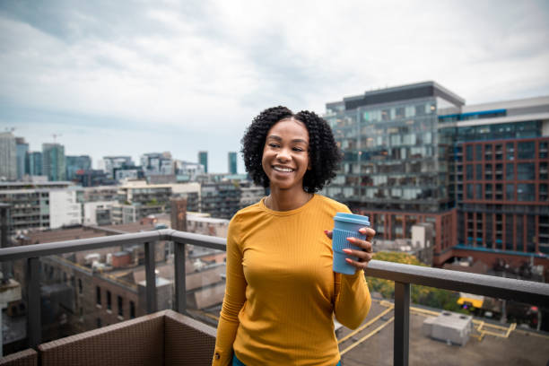 istock Woman Holding a Reusable Cup 1173618947