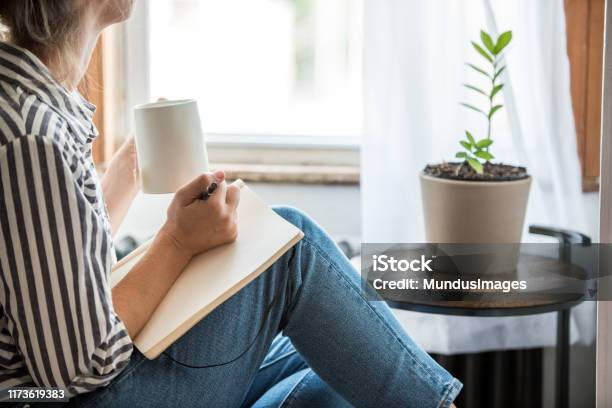 A Young Woman Taking A Break From Technology Stock Photo - Download Image Now - Writing - Activity, Diary, Handwriting