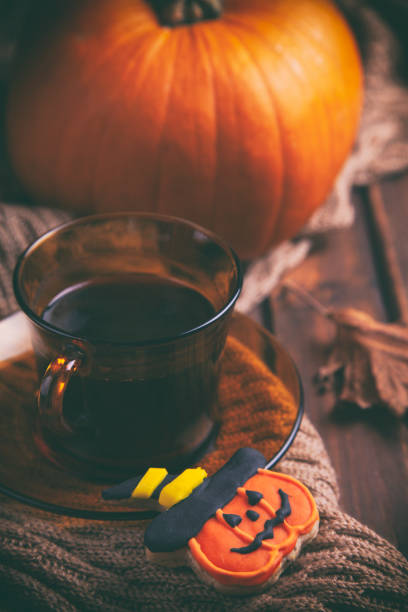 istock Morning coffee with gingerbread Halloween cookies on rustic wooden table 1173619520