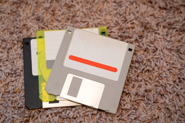 istock Three outdated 3.5 inch floppy disks, from the 1990s 1173619828