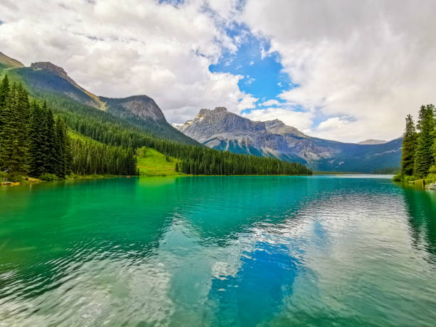 Emerald Lake and the President Range, Yoho National Park, Canada Emerald Lake is located in Yoho National Park, British Columbia, Canada, and it is the largest of 61 lakes and ponds located in this park. It is pictured here with the President Range of mountains. yoho national park photos stock pictures, royalty-free photos & images