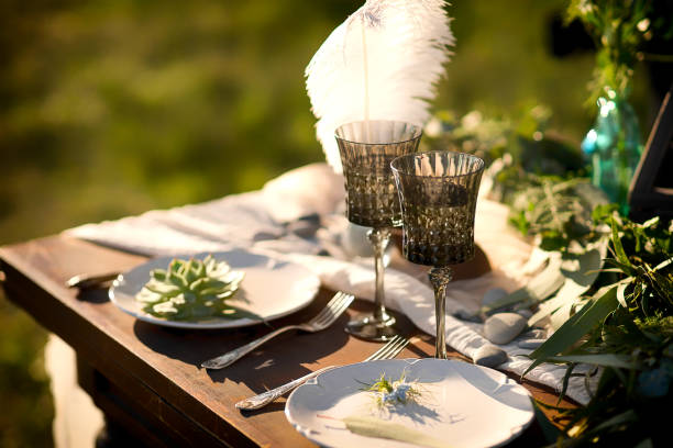 istock Vintage table setting with flower on a plate on a wooden table. Rustic style wedding decoration. 1173625767