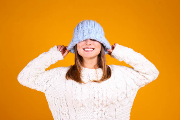 istock Gorgeous female with snow white smile posing over yellow background. 1173628390