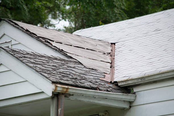 istock Damaged and old roofing shingles and gutter system on a house 1173628448