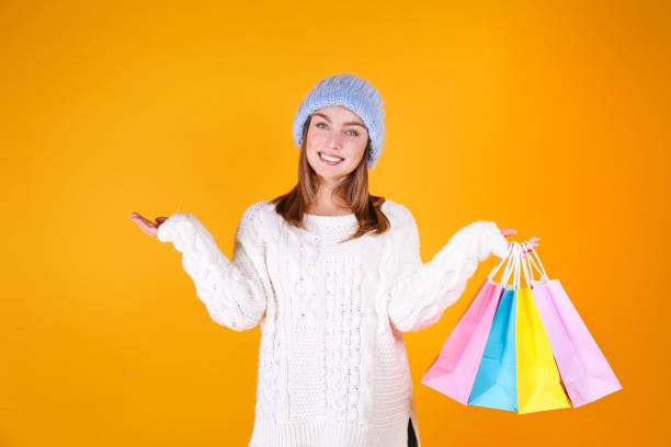 istock Gorgeous female with snow white smile posing over yellow background. 1173628545