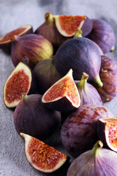istock Fresh figs. Food Photo. whole and sliced figs on beautiful rustic background. 1173628577