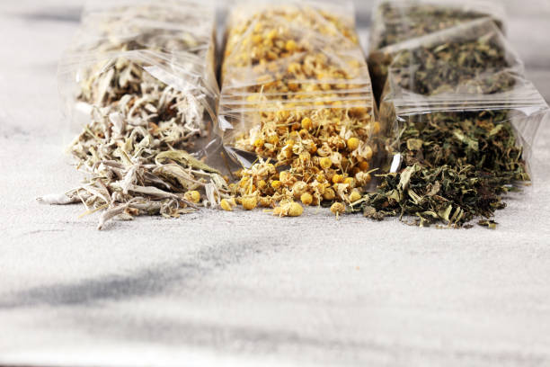 istock tea with Chamomile, sage and stinging nettle tea. Dried chamomile tea on table 1173632593