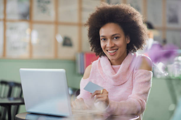 istock Woman using credit card for online shopping. 1173633051