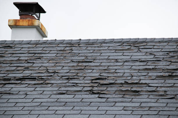 Damaged and old roofing shingles and gutter system on a house Damage to asphalt and asbestos shingles, gutter systems, chimney and roof flashing on residential home lost photos stock pictures, royalty-free photos & images