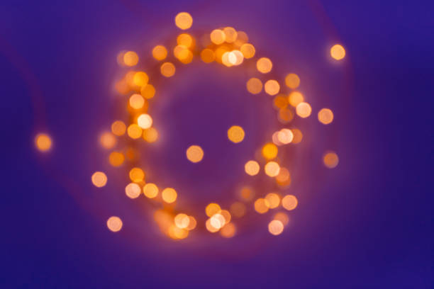 istock Blurred defocused magic fairy light glitter by Christmas lights on blue 1173639621