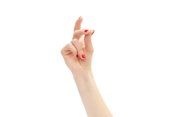 Woman's hand snapping by fingers. Isolated on white.