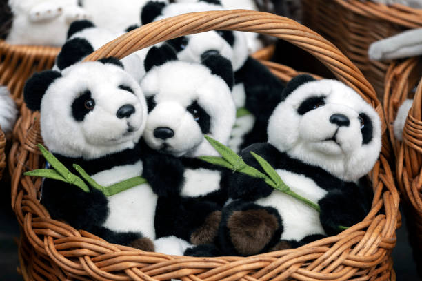 istock many panda soft toys in a wicker basket. close up 1173641190