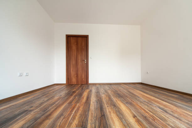 Empty room with hardwood floor and blank wall. Lots of copy space for your ideas.Please also see: