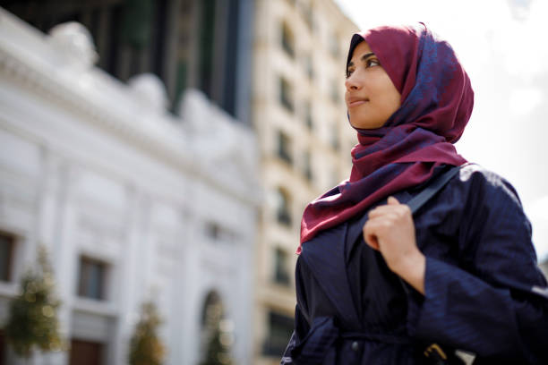 istock Smiling muslim woman travelling 1173641383