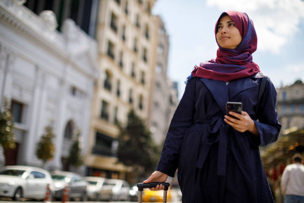 istock Smiling muslim woman travelling 1173641507
