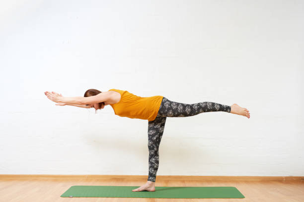 istock Healthy woman doing yoga exercise, stretching 1173642804