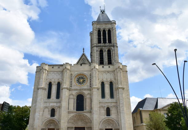 basilica of saint denis, west facade on a rainy day. paris, france. - basilica imagens e fotografias de stock
