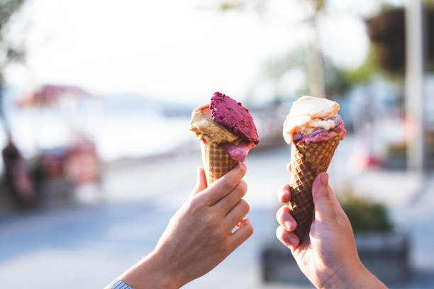 istock ice cream in couple hands 1173648805