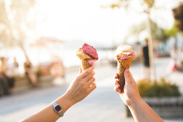 istock ice cream in couple hands 1173648807