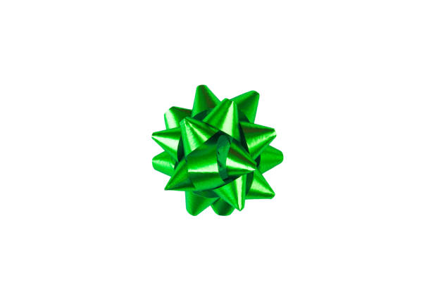 istock Green paper holiday bow over white isolated background. Single object. Mockup. Top view 1173649014