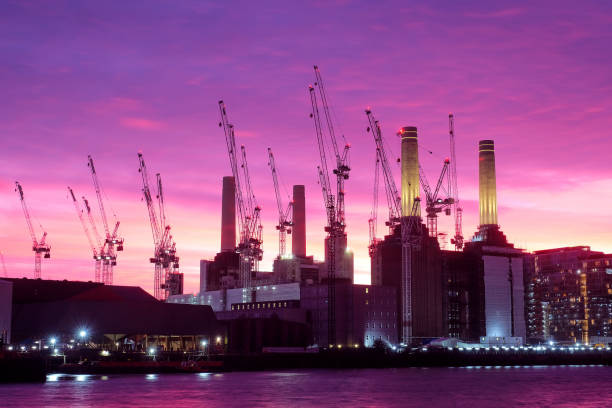 battersea and cranes Building cranes and Battersea Power Station at dusk in silhouette wandsworth photos stock pictures, royalty-free photos & images