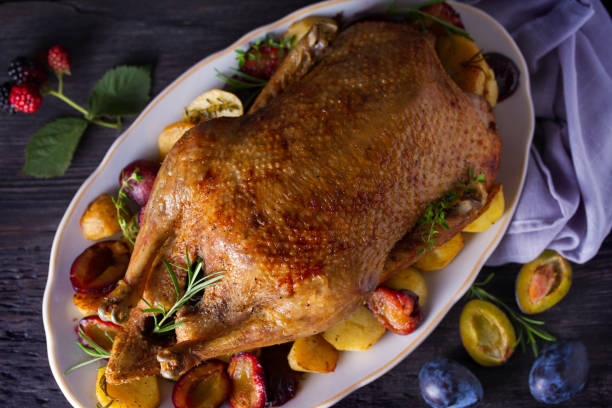 istock Whole duck with potatoes, plums and herbs 1173653963
