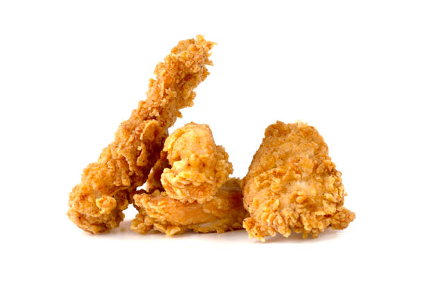 istock Fried chicken fillets on a white background. Fried chicken nuggets close-up. 1173654092