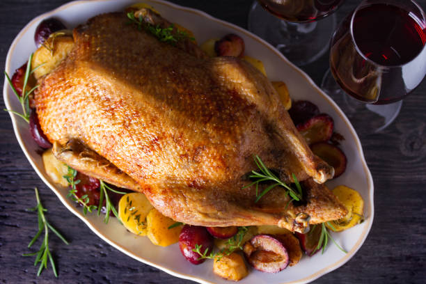 istock Whole duck with potatoes, plums and herbs 1173657006