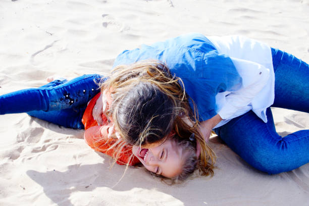 istock parents playing with their daughter 1173657446