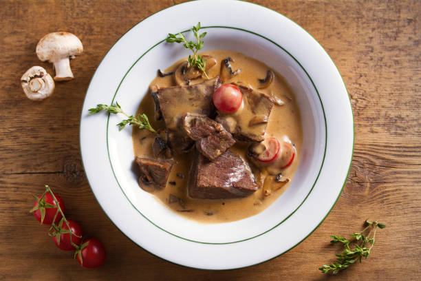 istock Braised veal cheeks in cream sauce with mushrooms 1173657492