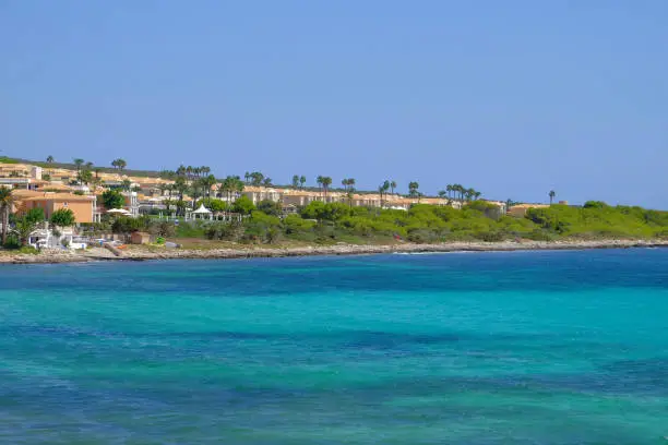 View on the beach Punta Prima with hotel resorts on Menorca, Balearic Islands, Spain.