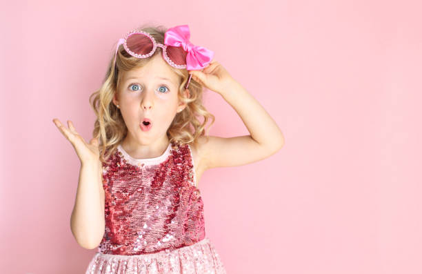 istock Little girl making a surprised expression. Party concept. 1173660988