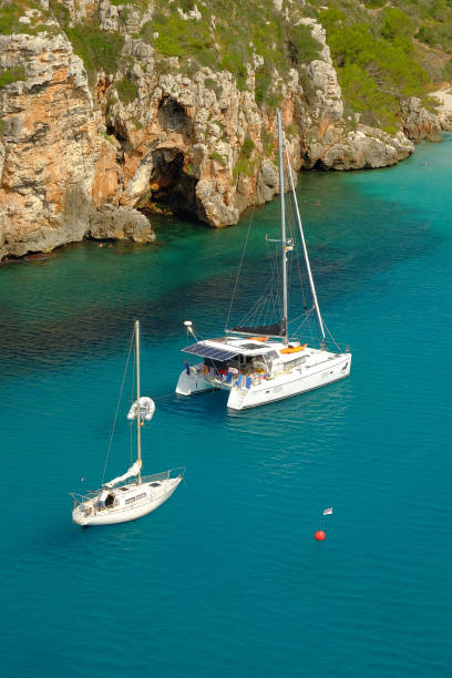 istock View on white boats on the beach Cala en Porter, Menorca. 1173661162