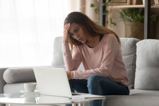 istock Frustrated girl look at laptop screen having operational problems 1173666064