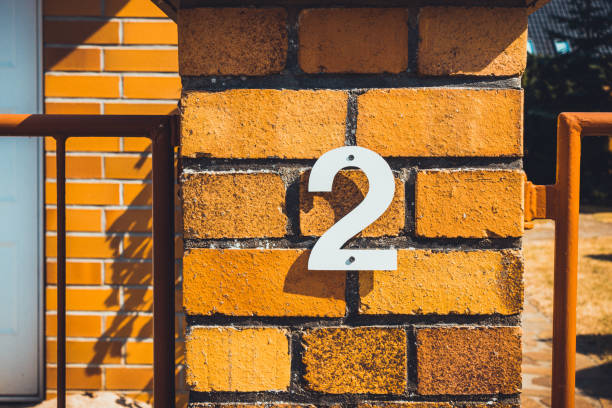 istock number two door sign on brick facade 1173666212