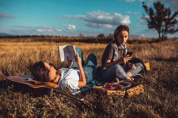 istock Two young women enjoying a picnic on a sunny summer day 1173670011