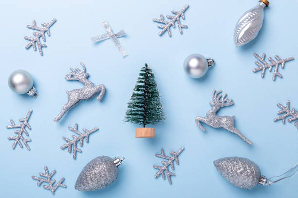 istock Christmas composition Fir tree and silver decoration on pastel blue background. Christmas, winter, new year concept 1173670986