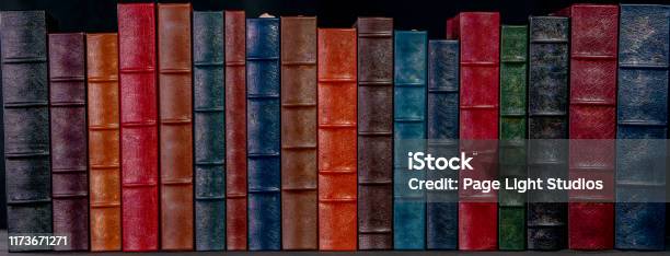 A Stack Of Leather Bound Books Stock Photo - Download Image Now - Spine - Body Part, Hardcover Book, Library