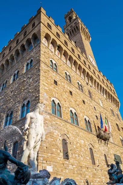 Statue of Neptune in a fountain in front of the Palazzo Vecchio - the town hall of Florence