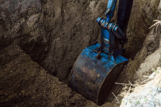 istock Bucket excavator digs soil at construction site. Construction hydraulic equipment. 1173672717