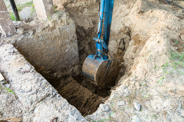 istock Bucket excavator digs soil at construction site. Construction hydraulic equipment. 1173672719