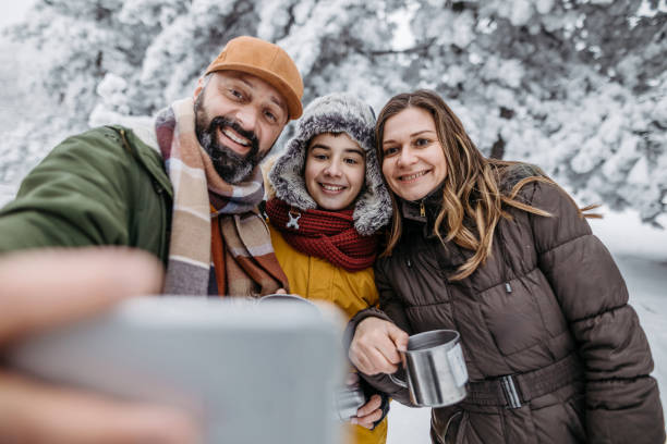 istock Family making selfie on winter holiday 1173674808